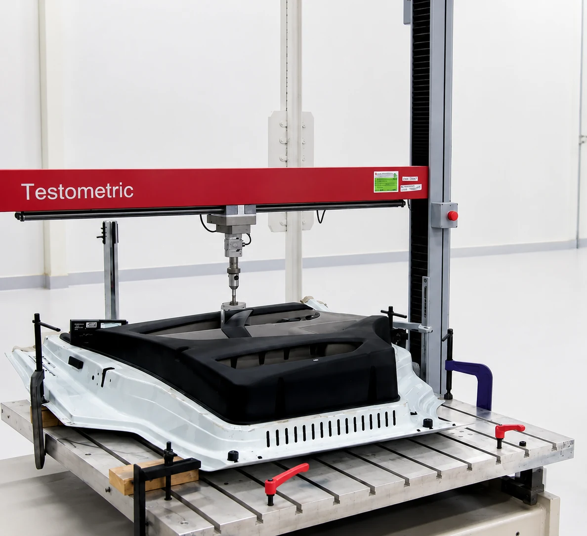 Testometric wide-frame universal testing machine testing a full-size automotive component at Faurecia Technical Centre India