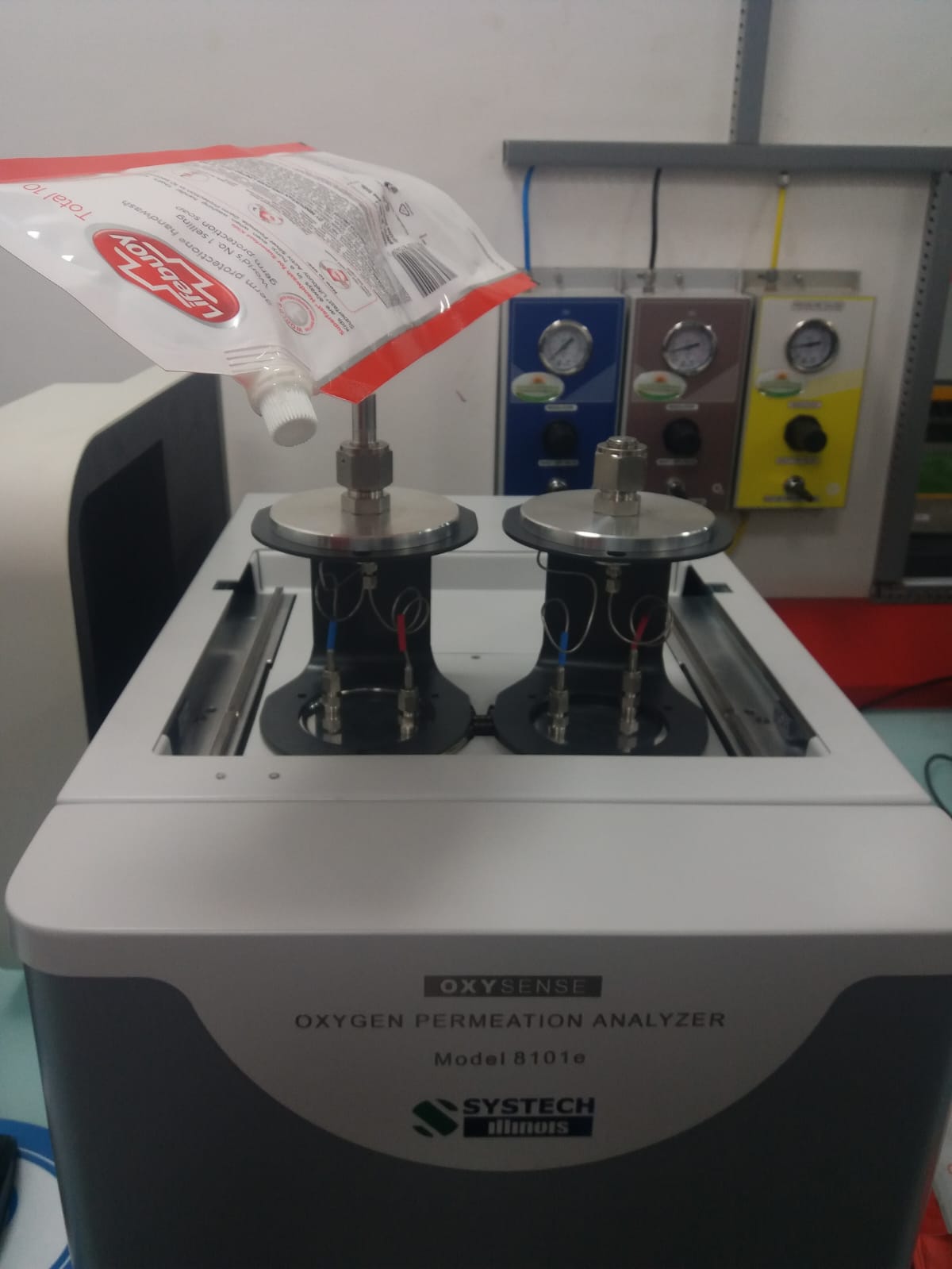 Systech 8101e OTR analyzer testing a pharmaceutical pouch at Abbott, India
